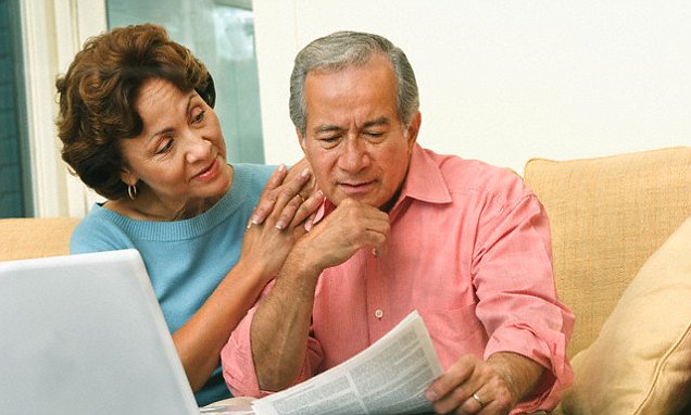 Couple Doing Paperwork with Laptop