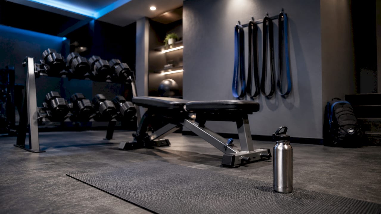 Home gym with dumbbells and bands
