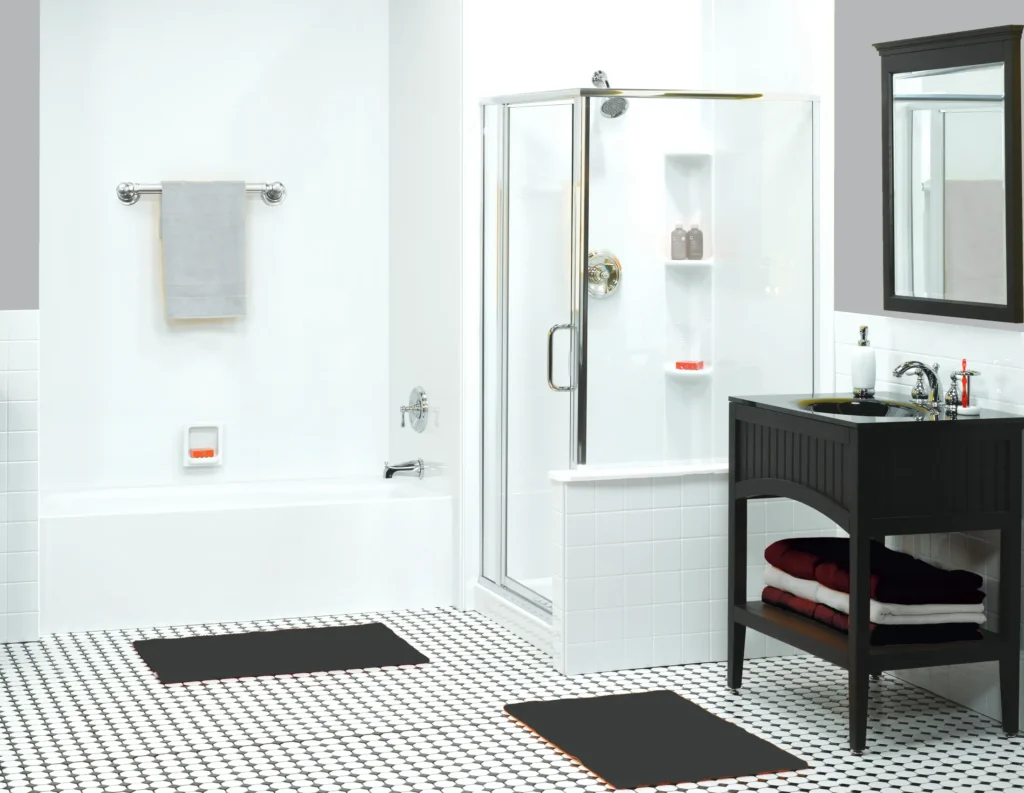 White bathroom with separate glass shower, bathtub and black vanity cabinet.