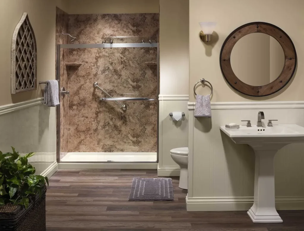 Classic bathroom with marble effect shower panels glass door and pedestal sink